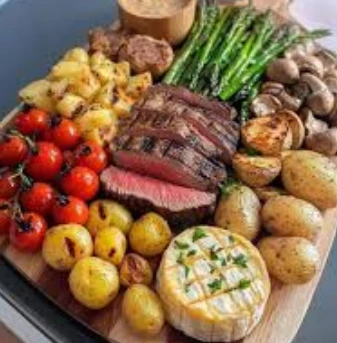 VEGETABLE SIZZLER (VEGETABLE STEAK SERVED WITH CHARRED VEGETABLES HOME FRIES AND HERB SAUCE )