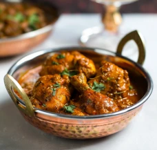 KADHAI MURGH (CHICKEN PIECES COOKED IN WHOLE SPICES ALONG WITH TOMATO PEPPER GRAVY)